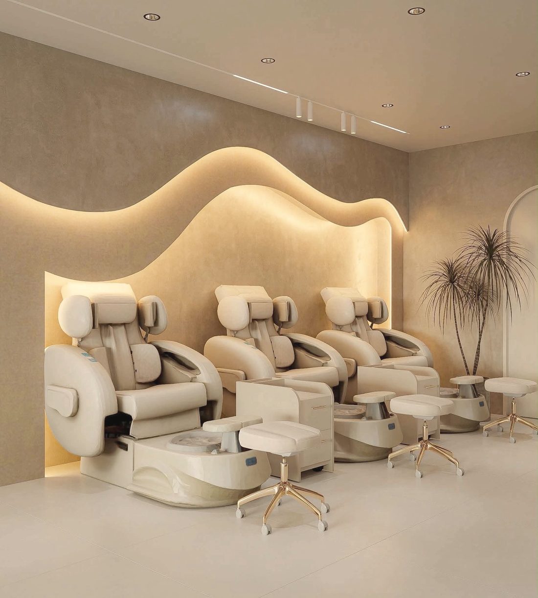 Cream pedicure chairs beneath the glowing wave in the new lounge
